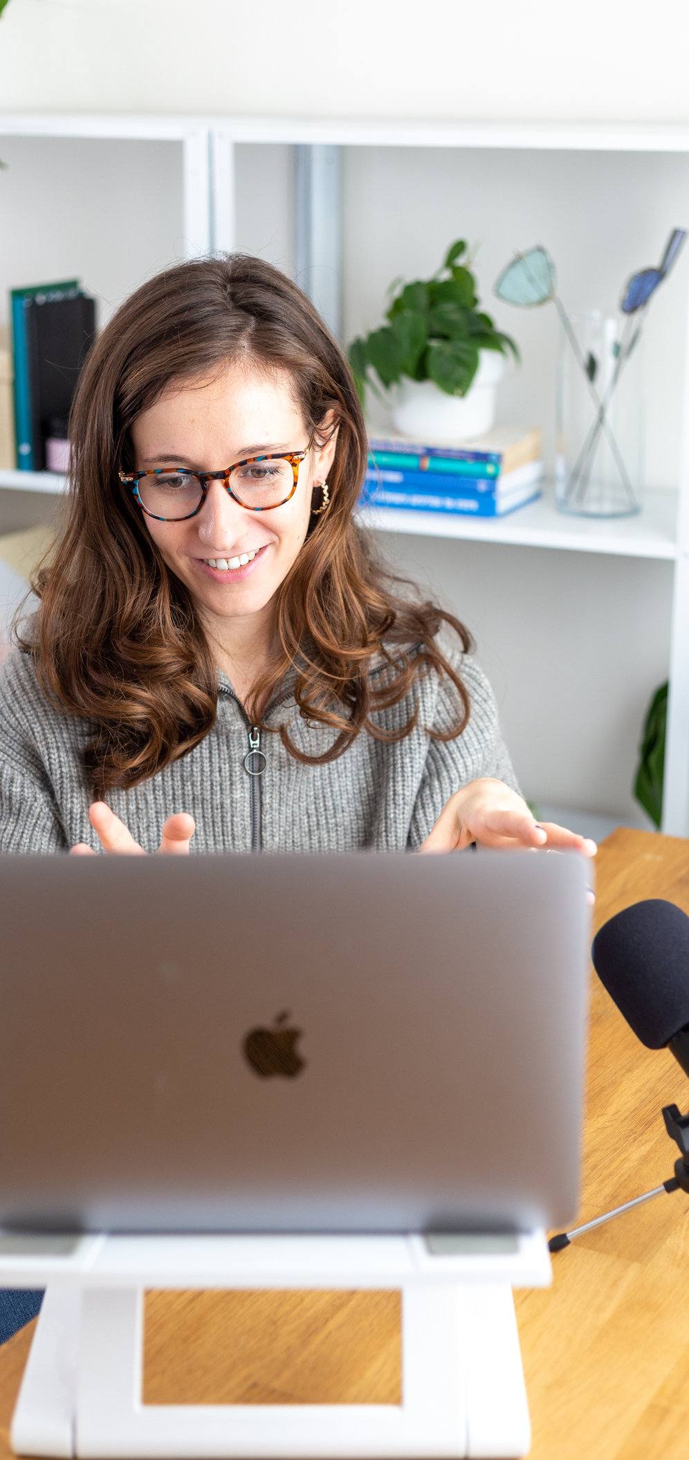 Sara Royf working on her laptop